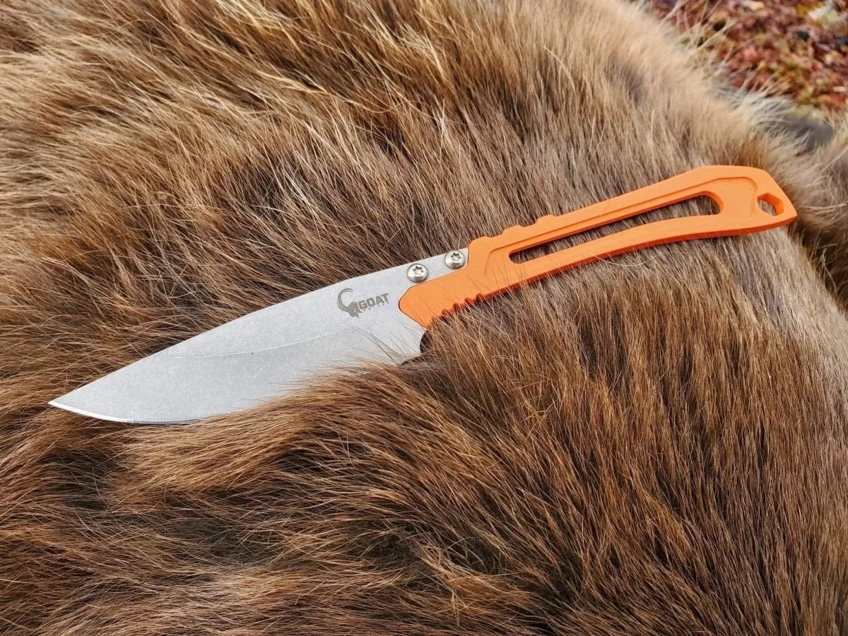 Goat Knives Tur Skeleton Pro orange handle on fur