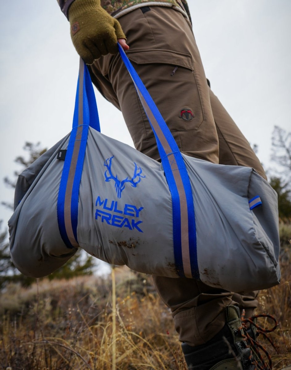 Hunter carrying Muley Freak game bags, ensuring clean meat preservation.